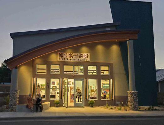 Art gallery windows glowing in evening