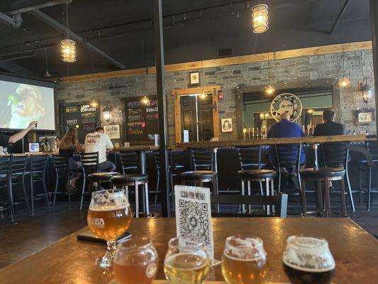 a flight from a table across from the bar. more seating behind the tables and the bar!
