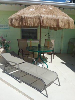 Tiki umbrella chairschaise lounger right outside your suite