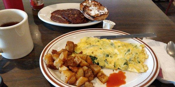 Spinach & feta omelet with hash browns, English muffin & sausage patties. So full!
