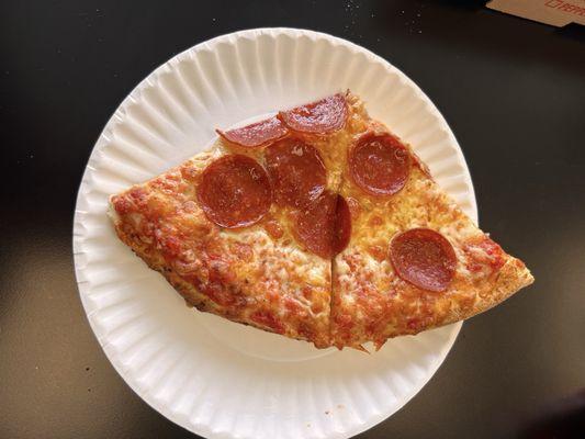 Pepperoni slices off a pie