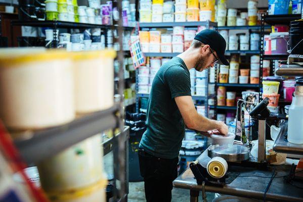 Mixing inks in house to get the perfect Pantone.