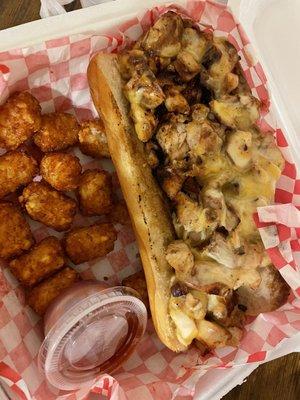 Chicken Philly Cheesesteak (asked for no veggies) with Tater Tots.  Ate some tots pre-photo and there's more under the sandwich.