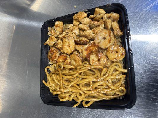 Chicken and shrimp plate fire with the spicy noodles you guys must try it out