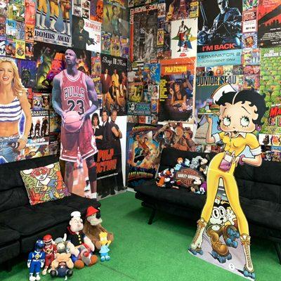 Come take a photo behind our poster wall!