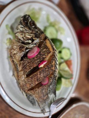 Whole fried tilapia, crunchy, well seasoned tender and tasty!