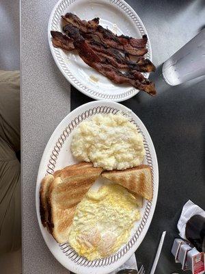 Eggs over medium, grits with a side of crunchy bacon (as I order it). I like to put bacon in my grits