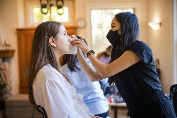 Wedding day makeup in progress. Photo by Toanven Photography