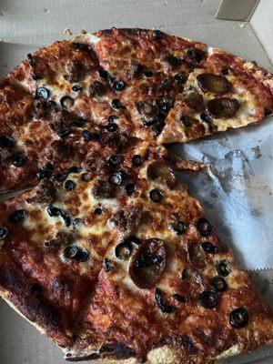 Half meatball half sausage with black olives and crispy