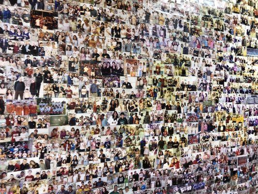 Wall full of pictures of customers enjoying their ice cream