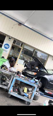 This guy knows nothing about cars & NO ENGLISH! Literally putting pressure, pressing & sitting on engine, transmission, other parts as seen!