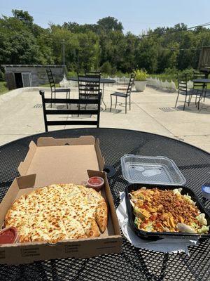 Garlic cheese bread and taco salad . Patio space