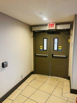 Pair of metal doors with auto swing operator