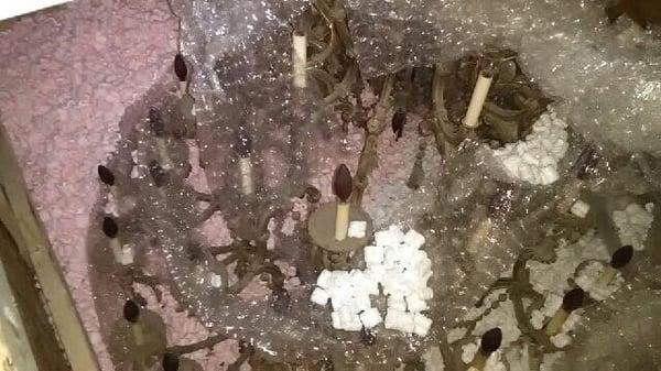 Huge Chandelier uninstalled and packaged up by Eduardo.