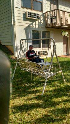 Enjoying the free continental breakfast with a cup of coffee.