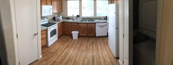 Kitchen (duh) with washer/dryer peeking at you.