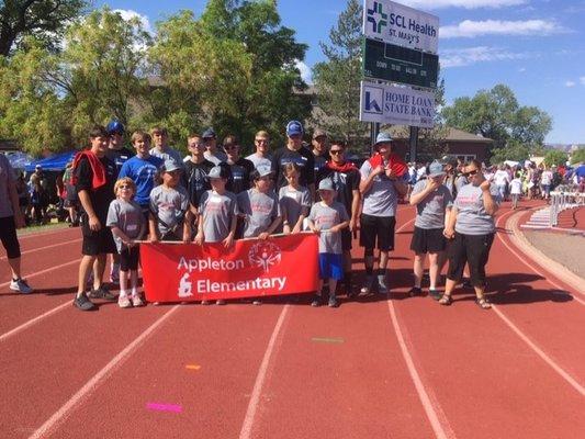 Appleton Elementary Special Olympians with Fruita Monument High School football players.