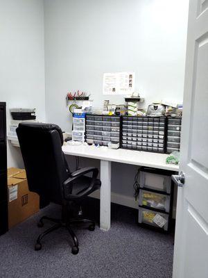 Interior photo of the hearing aid lab for AudioNova hearing clinic in Jupiter, FL