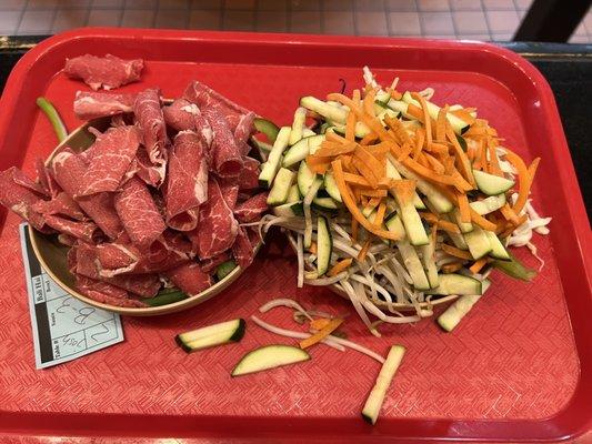 My bowls: lots of vegetables and beef. My sauce: spicy sauce level 3. Remember that after cooked it will all shrink