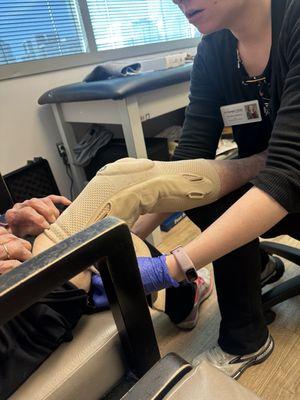 This is Rose fitting my mother for her knee brace! Yes, I had my mother see Rose!