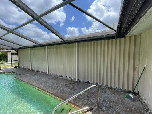 Accordion shutter with recessed floor track