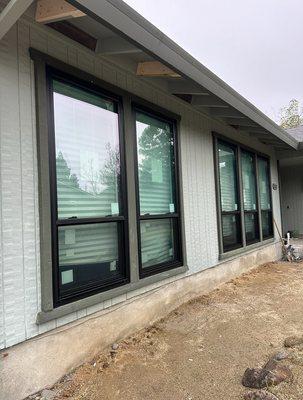 Anlin Panoramic vinyl windows installed as a retrofit replacement. Improved energy efficiency clean look and smooth operation