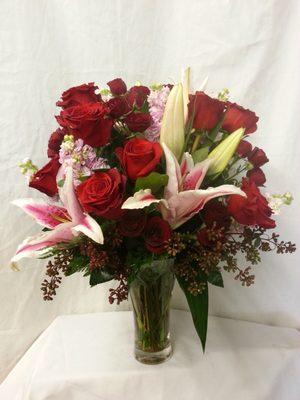pink stargazer lilies and red roses to express your love ones special day.