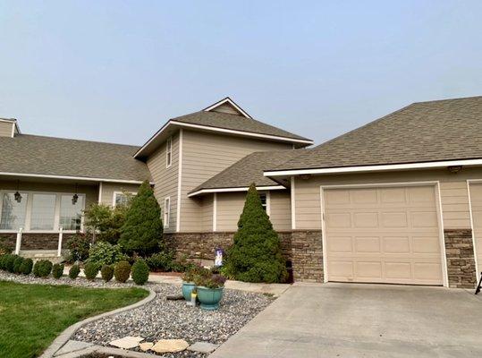 fiber cement lap siding, stone,  fascia and paint