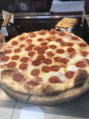 Pepperoni pizza by the slice