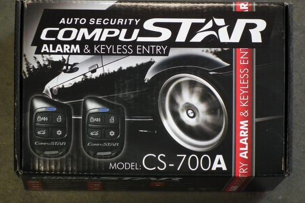 CS-700A basic alarm with adjustable dual stage shock sensor, two 4 button remotes , and trunk release option