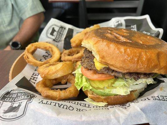 Classic burger with the fresh bread and beer batter onion rings.