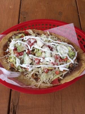 Huarache ( fried masa base, chicken, tomatoes, lettuce, & green salsa )...