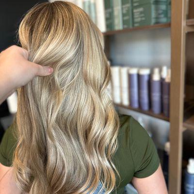 Bright, blended blonde with soft waves created in our Murrieta salon for a seamless, dimensional, low-maintenance glow.