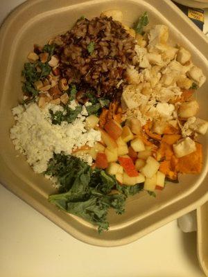 harvest green with warm wild rice, chicken, sliced apples, sweet potatoes, goat cheese, kale, sliced almonds.