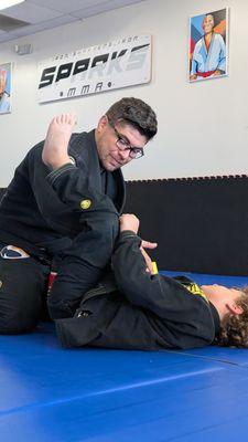 Coach Samuel introducing Spider-lasso guard movements and concepts for Little Sparks