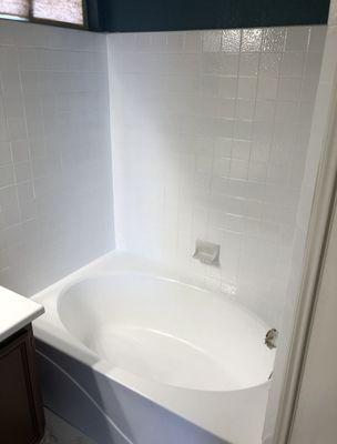 After some TLC. Freshly resurfaced tub and surround.