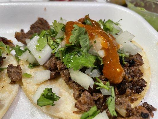 Tacos de Asada con chile rojo.