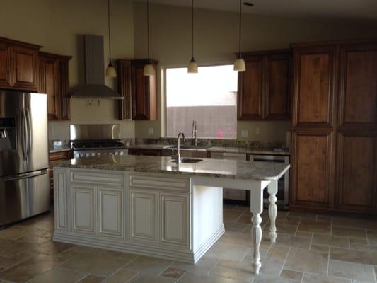 A French-style kitchen developed by 911 Home Design & Construction, LLC.