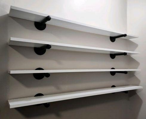 Custome Whitte Shelves 6" X 48" with Black pipe mounts.