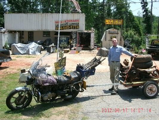 Here is front of shop and the Owner with 50+ years of Motorcycle/Moped knowledge. Note phone number.