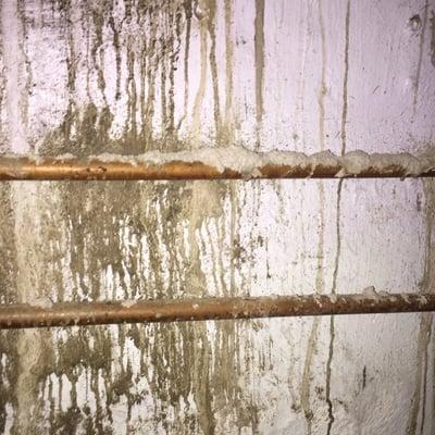 This is the wall after concrete was done. When I complained ... They painted over it