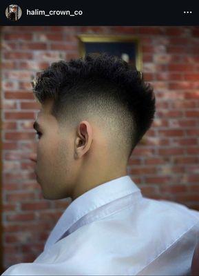 Skin fade is a smooth transition from fully shaved zones to length, creating a clean, contrasting and modern style.
