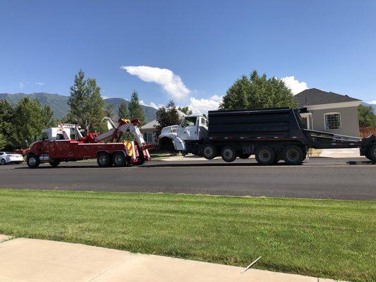That dump truck had no front tires! It was insane to watch!!