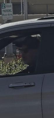 Picture of the owner in his vehicle trying to run me over! Total psycho