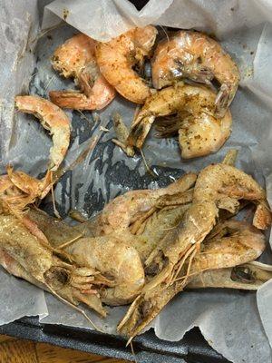The peel and eat shrimp are at the top the seasoning was only on the outside of the shells also tasted like crap