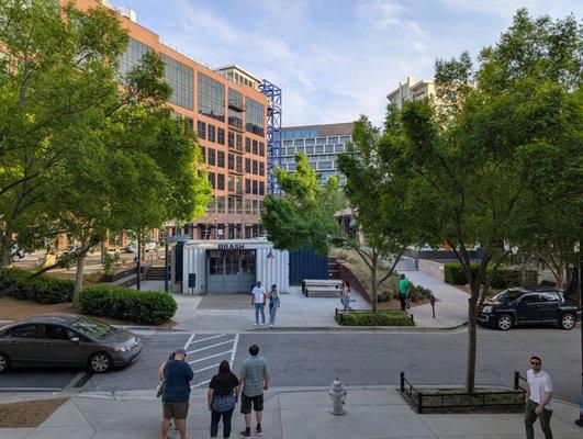 View from top of stairs above Ormsby's, facing Brash Coffee and the Interlock across the street.