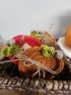 Crochet pumpkin and apple coasters.