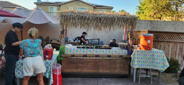 The palapa top is ours, but they brought everything else they needed!