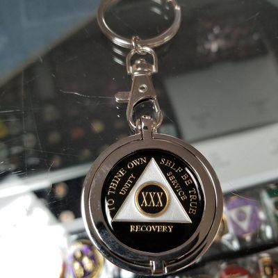 AA recovery medallion with a chrome keychain