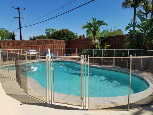 Aqua Safe 4' tall premier Tan border and poles with Brown fabric for transparency.